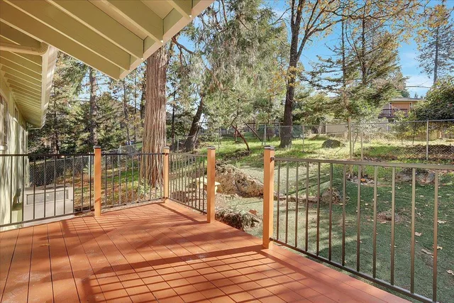 a view of balcony with wooden floor