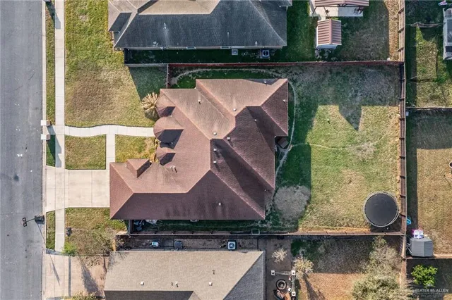 an aerial view of a house with swimming pool