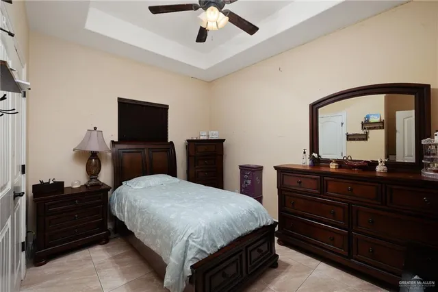 a bedroom with a bed and a dresser