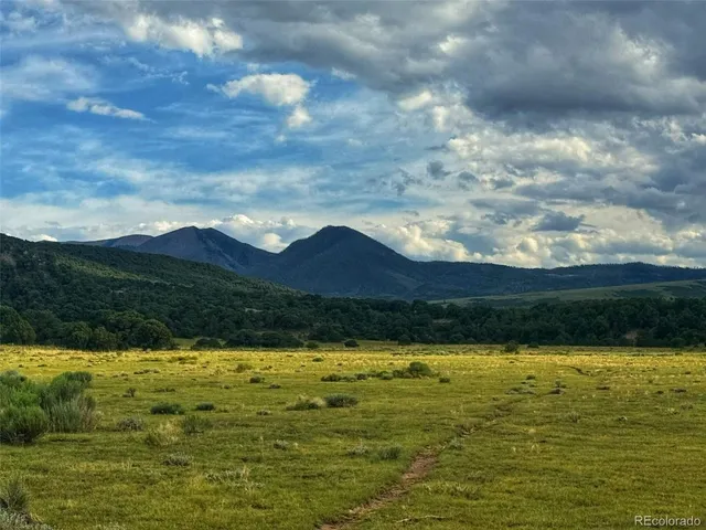 a view of an swimming pool and mountain