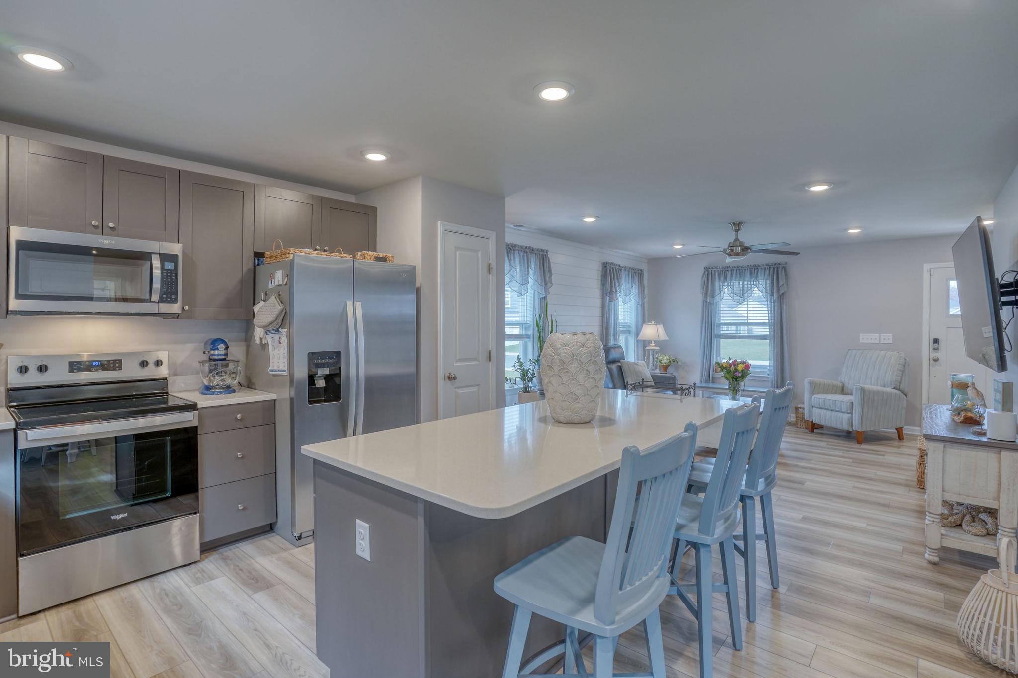 653 Cpl Rodney Wayne Wilson Loop Georgetown, DE 19947 - Photo 13 of 55 a large kitchen with a table and chairs