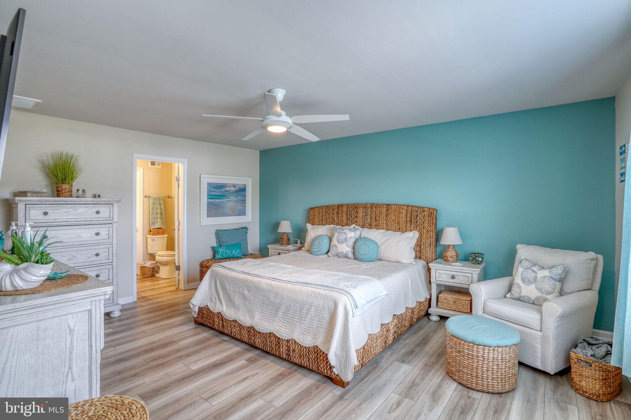 653 Cpl Rodney Wayne Wilson Loop Georgetown, DE 19947 - Photo 27 of 55 a bedroom with a bed and wooden floor