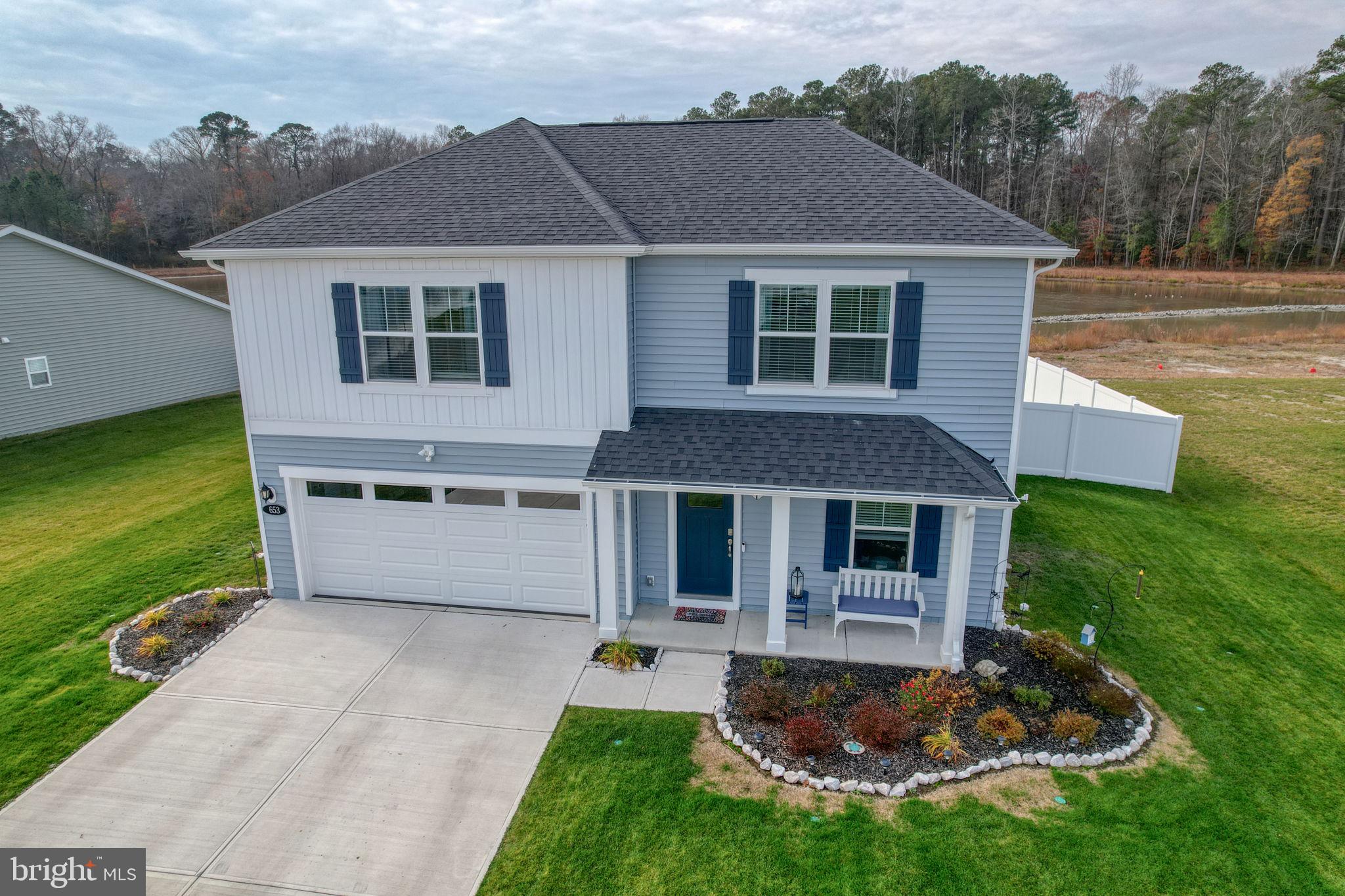 653 Cpl Rodney Wayne Wilson Loop Georgetown, DE 19947 - Photo 3 of 55 a view of a house with a yard and a large tree