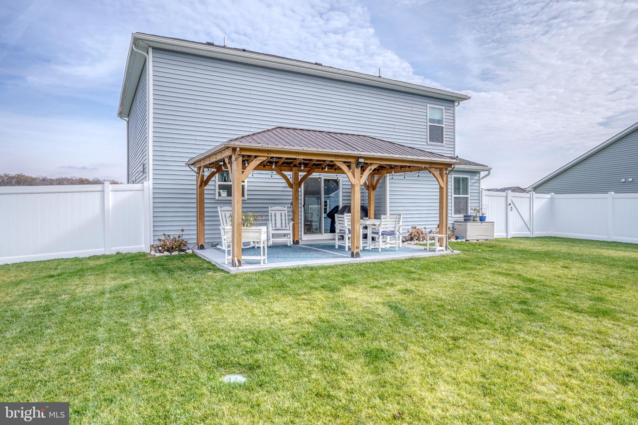 653 Cpl Rodney Wayne Wilson Loop Georgetown, DE 19947 - Photo 44 of 55 a view of a chair and table in the backyard of the house
