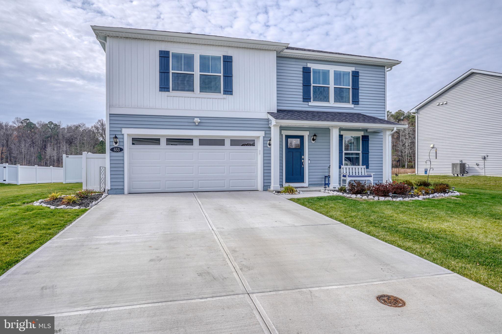 653 Cpl Rodney Wayne Wilson Loop Georgetown, DE 19947 - Photo 50 of 55 a front view of house with yard and garage