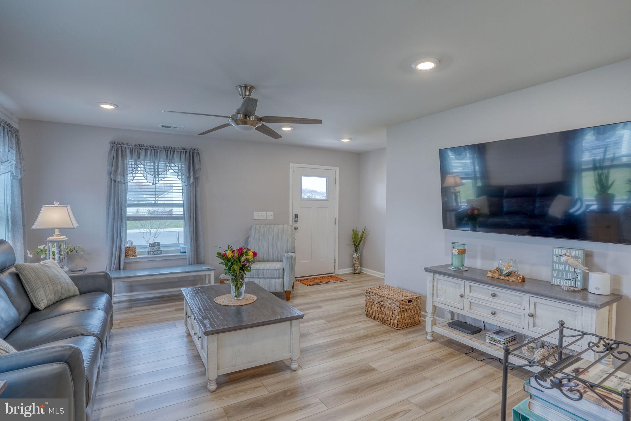 653 Cpl Rodney Wayne Wilson Loop Georgetown, DE 19947 - Photo 9 of 55 a living room with furniture kitchen view and a wooden floor