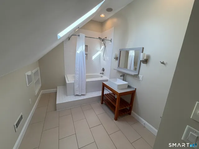 a room with table and mirror