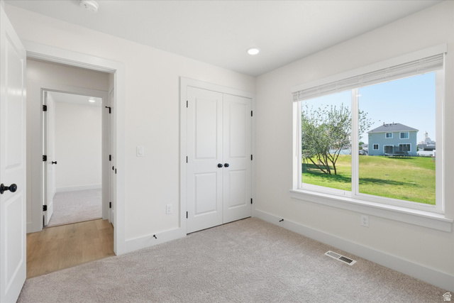 730 West 500 North Smithfield, UT 84335 - Photo 16 of 46 Carpeted room featuring a large window, recessed lighting, and white trim