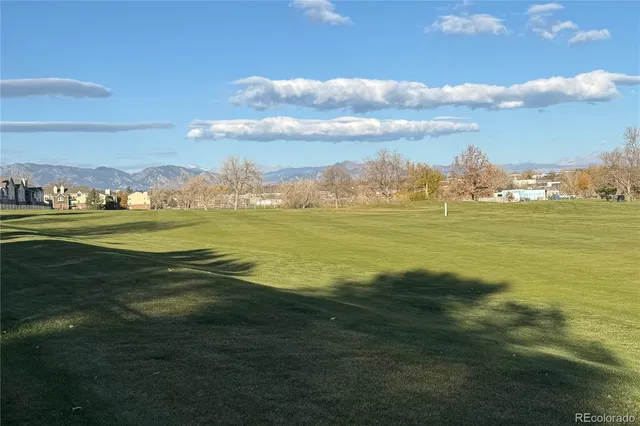 a view of an ocean with a building in the background
