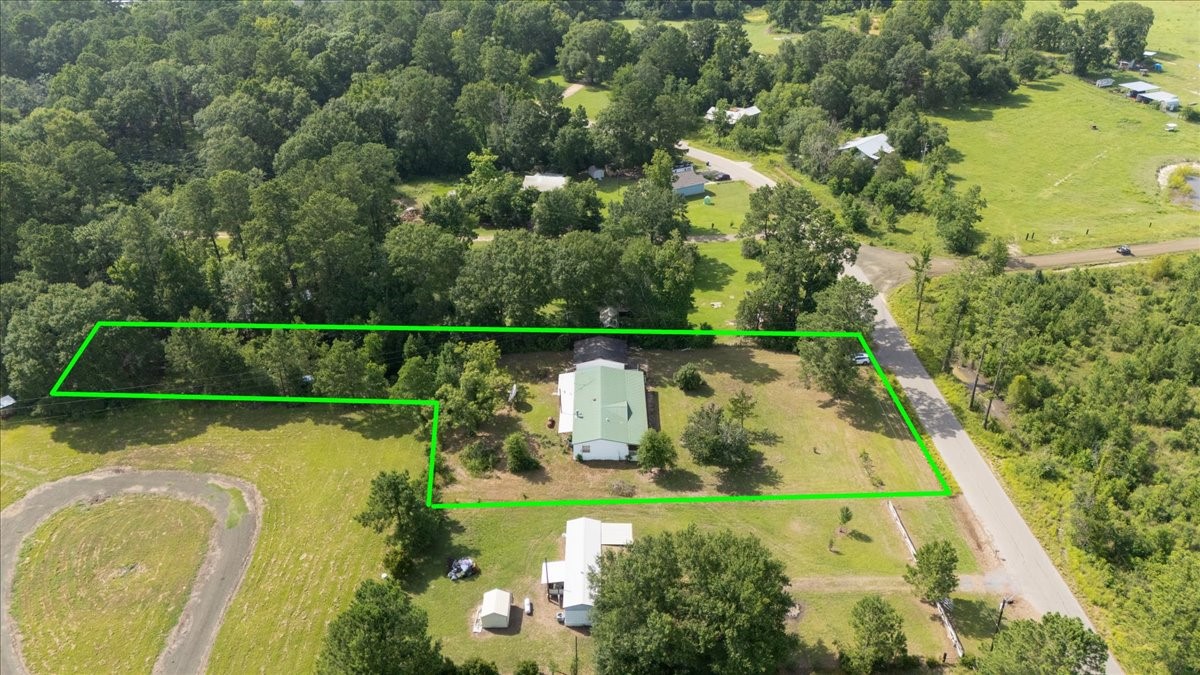 6505 County Road 200 Brookeland, TX 75931 - Photo 2 of 34 an aerial view of a residential houses with outdoor space and swimming pool