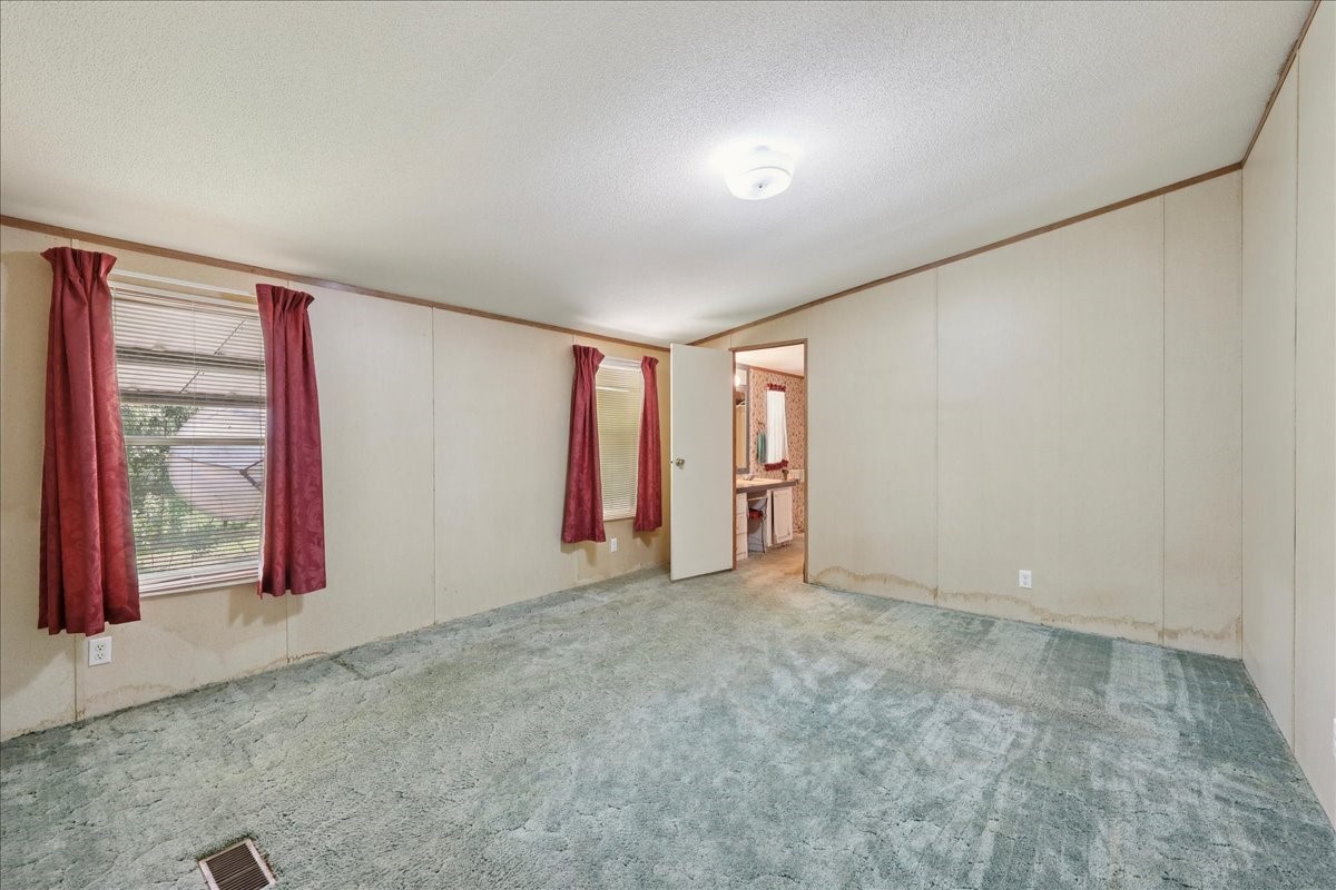 6505 County Road 200 Brookeland, TX 75931 - Photo 22 of 34 an empty room with window