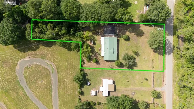 an aerial view of a house with a lake view