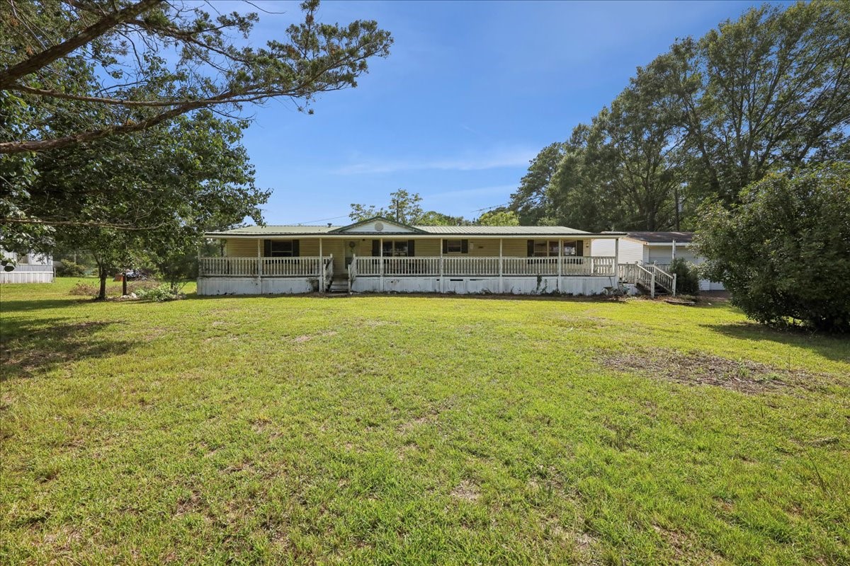 6505 County Road 200 Brookeland, TX 75931 - Photo 5 of 34 a view of a house with a big yard