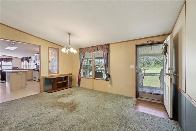 a view of kitchen with furniture stove and refrigerator
