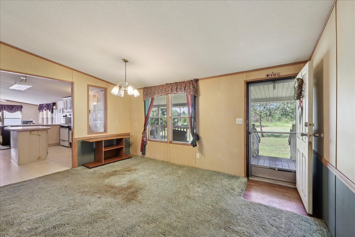 6505 County Road 200 Brookeland, TX 75931 - Photo 10 of 34 a view of kitchen with furniture stove and refrigerator