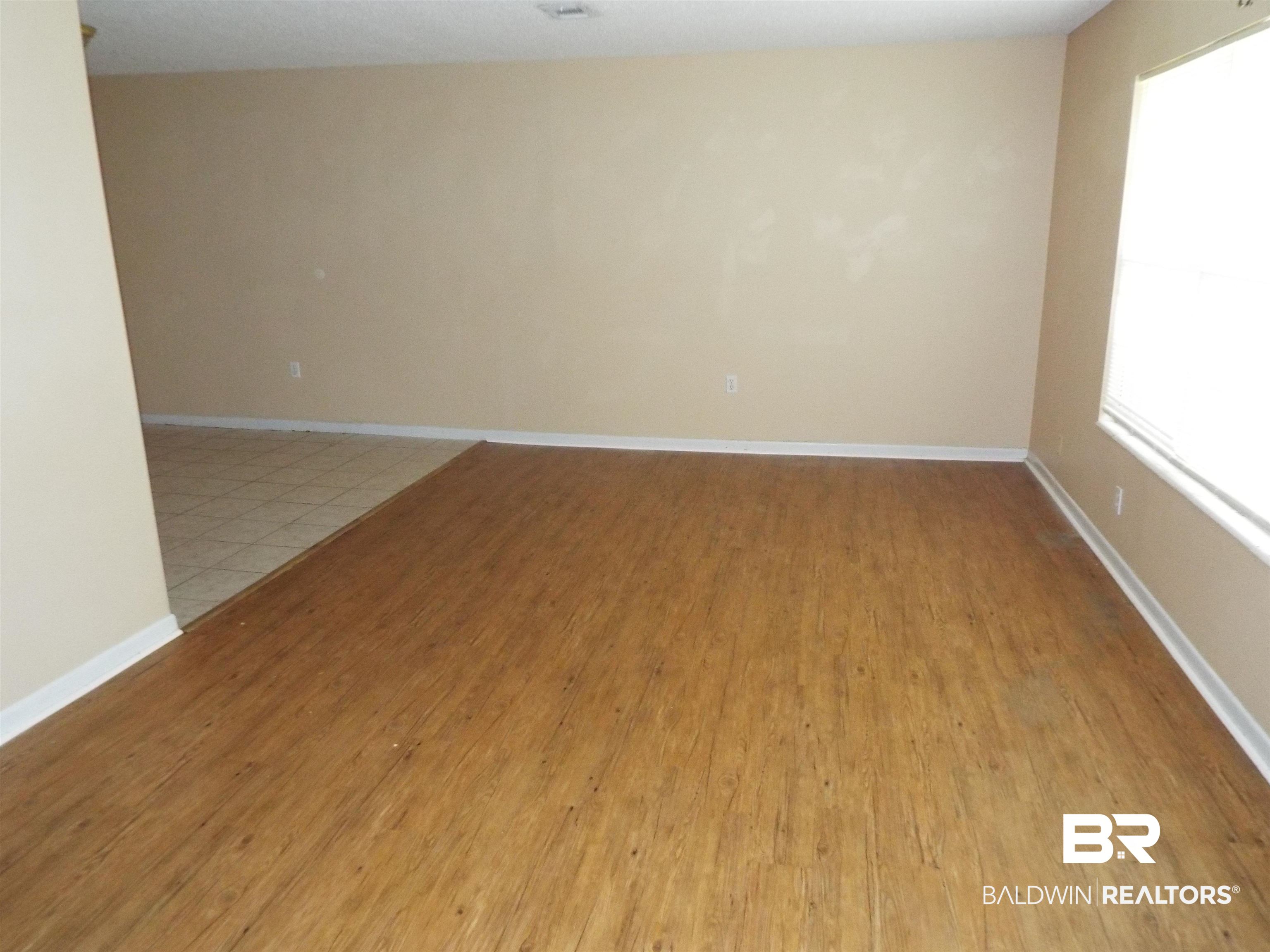 604 Southern Way Spanish Fort, AL 36527 - Photo 4 of 13 Spare room featuring light hardwood / wood-style flooring