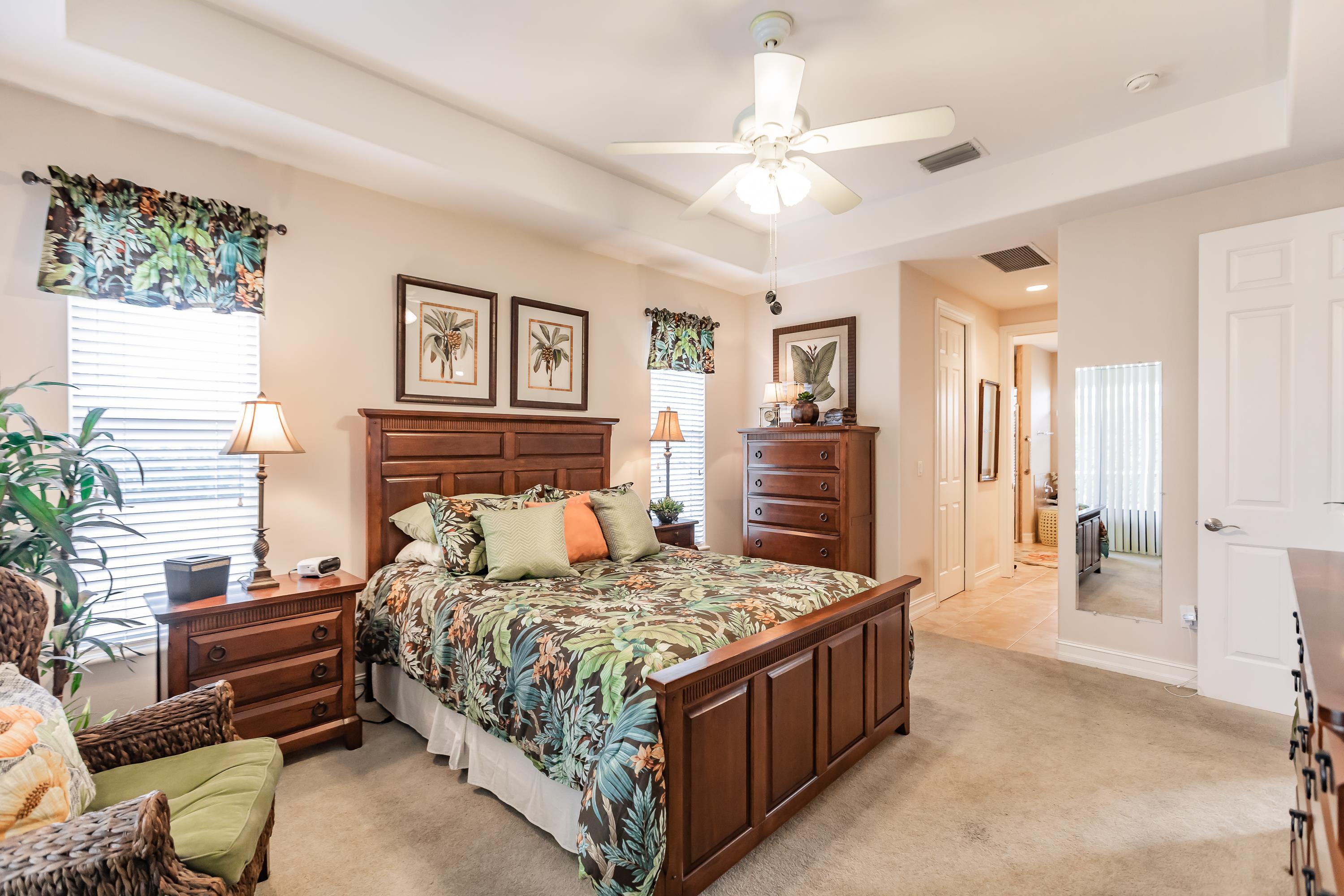 31 Tahiti Road Marco Island, FL 34145 - Photo 16 of 31 a bedroom with a bed couch and a window