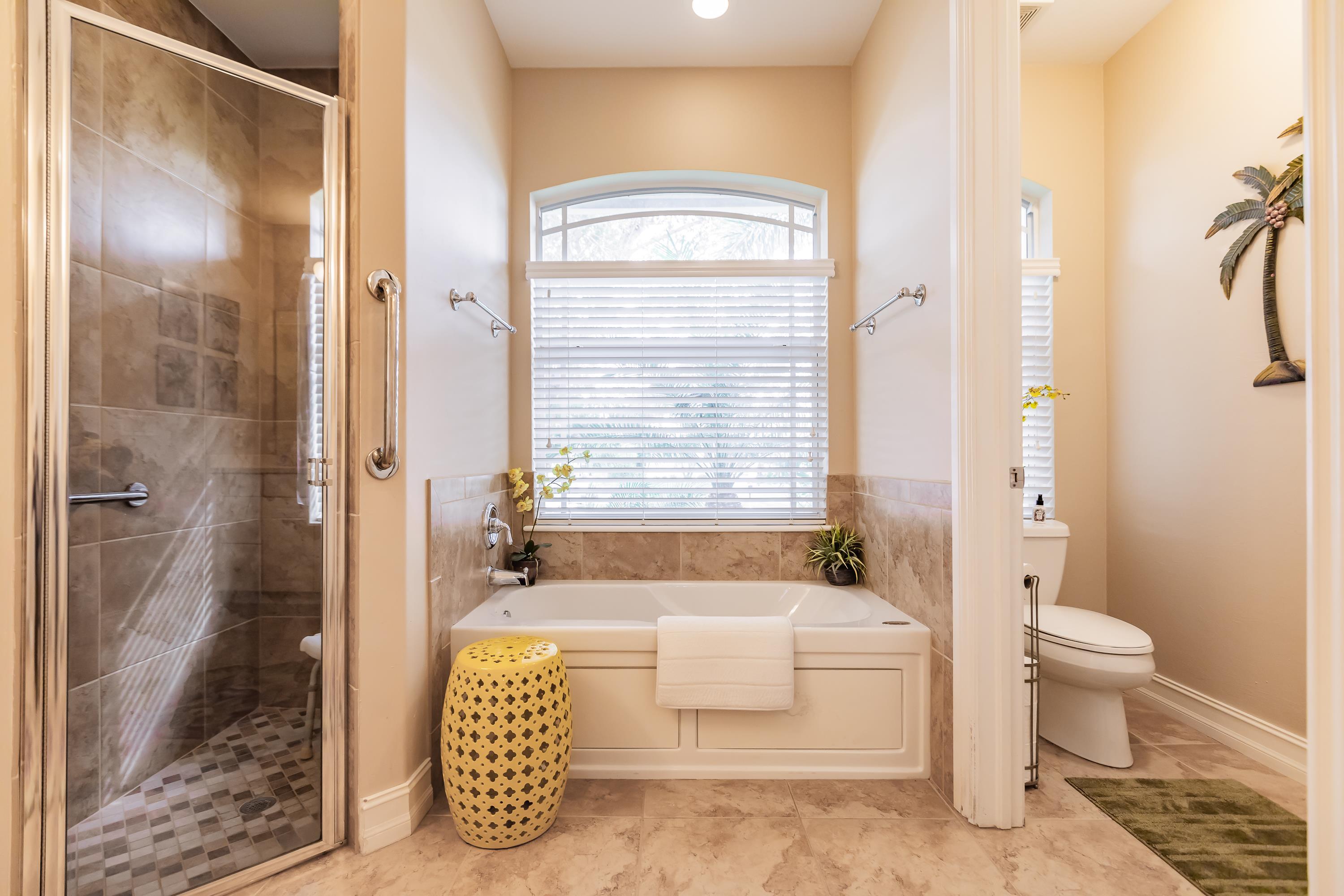 31 Tahiti Road Marco Island, FL 34145 - Photo 17 of 31 a spacious bathroom with a bathtub and shower