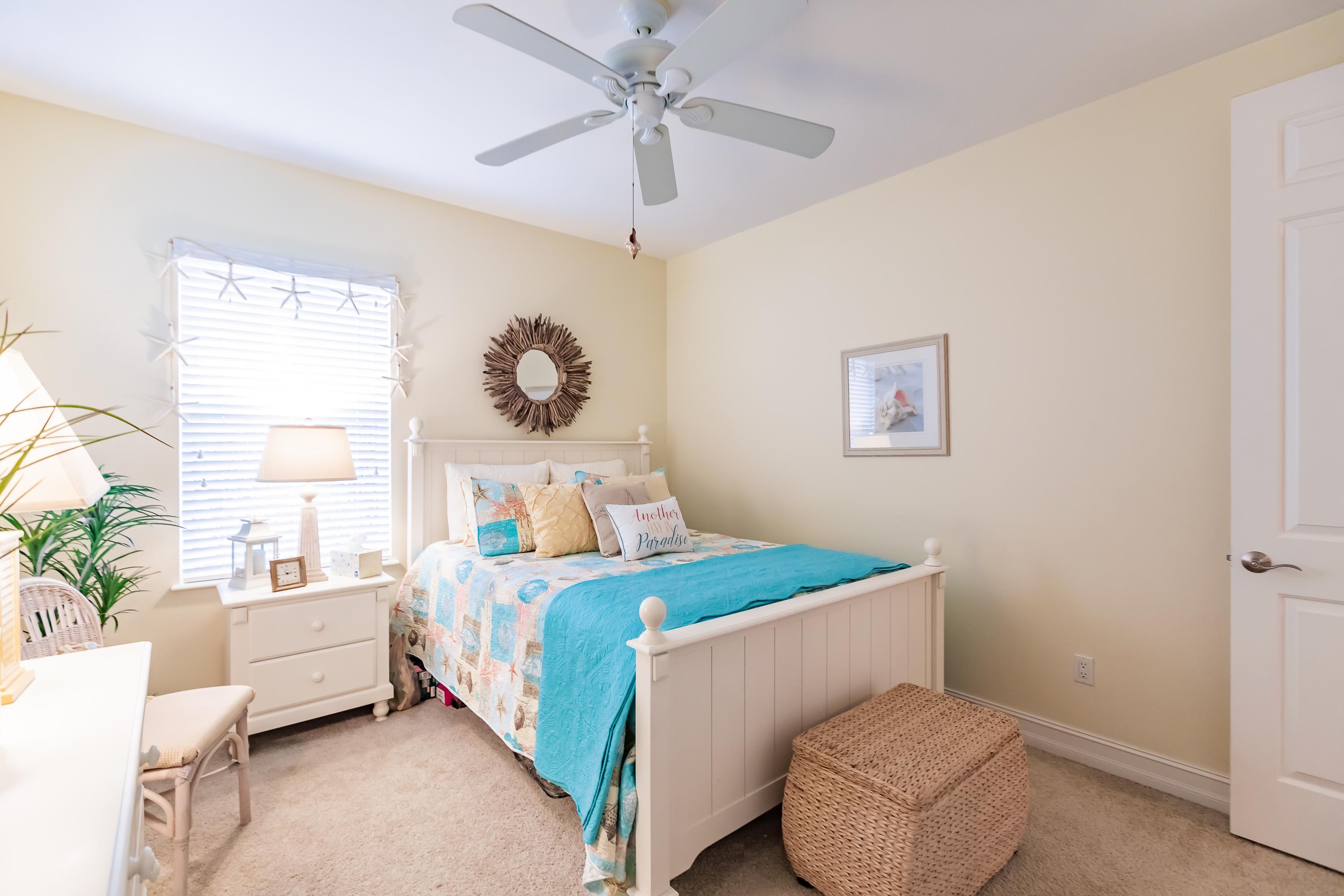 31 Tahiti Road Marco Island, FL 34145 - Photo 24 of 31 a bedroom with a bed and a chandelier