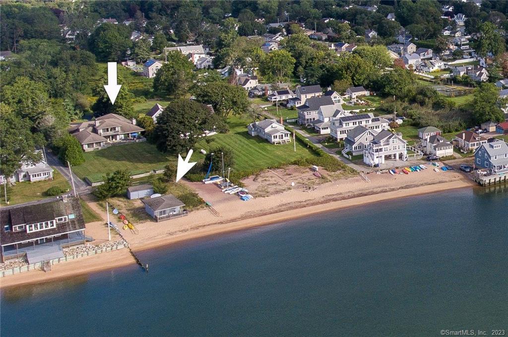 85 Beach Avenue Madison, CT 06443 - Photo 1 of 1 an aerial view of a house with a yard and lake view in back