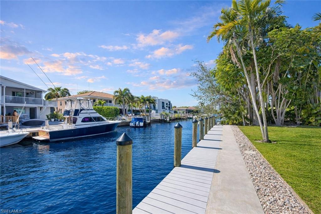 1686 Blue Point Avenue, Unit B5 Naples, FL 34102 - Photo 21 of 46 a view of outdoor space yard deck and barbeque oven