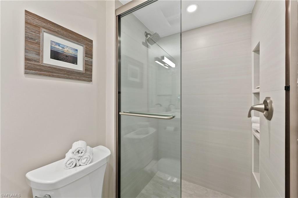 1686 Blue Point Avenue, Unit B5 Naples, FL 34102 - Photo 27 of 46 a bathroom with a shower