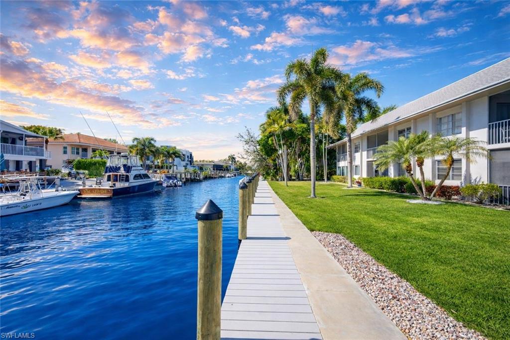 1686 Blue Point Avenue, Unit B5 Naples, FL 34102 - Photo 37 of 46 a park with lots of palm trees and plants