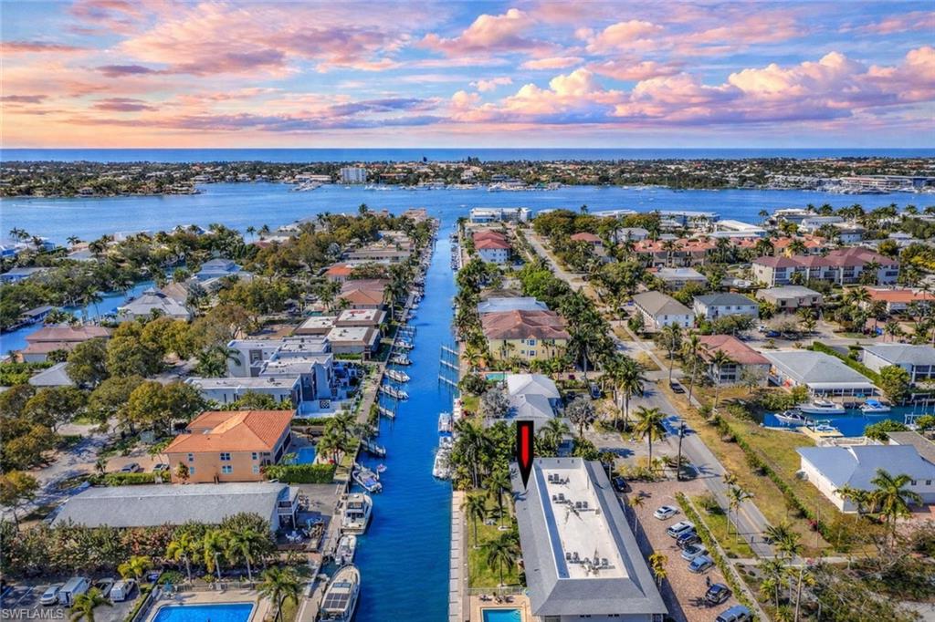1686 Blue Point Avenue, Unit B5 Naples, FL 34102 - Photo 38 of 46 a view of a city with mountains