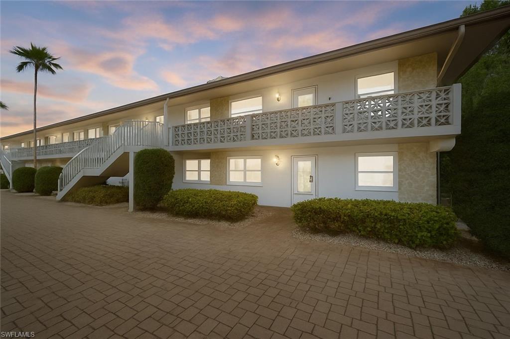 1686 Blue Point Avenue, Unit B5 Naples, FL 34102 - Photo 43 of 46 a front view of a house