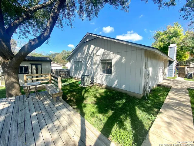 a backyard of a house with seating space