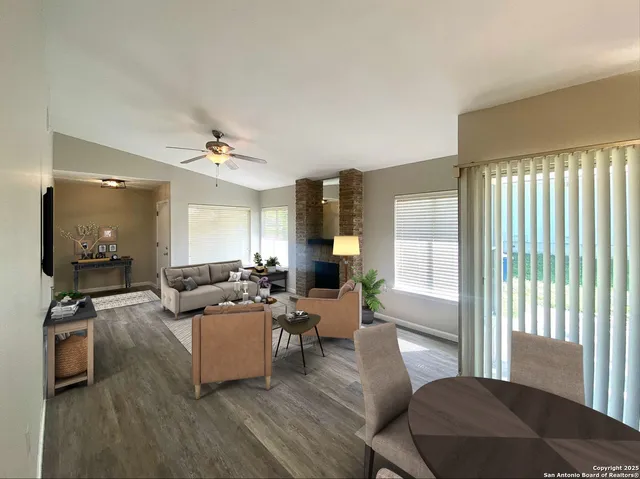 a living room with furniture and a window