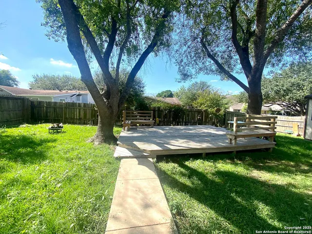 a view of swimming pool with a table and chairs
