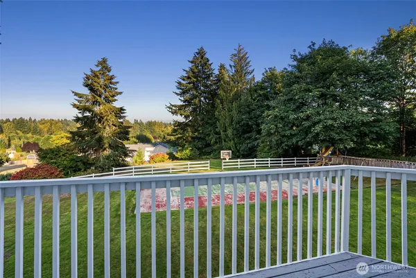 a view of a fence and trees
