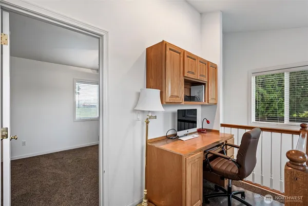 a view of a kitchen with furniture and a fireplace
