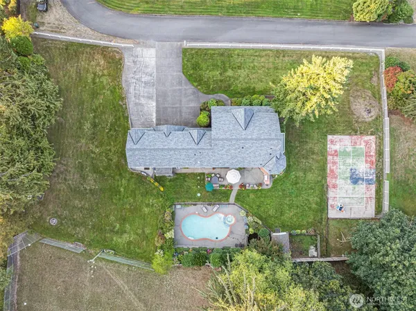 an aerial view of a house with garden space sitting space and swimming pool