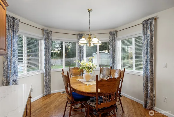 a view of a dining room with furniture window and outside view