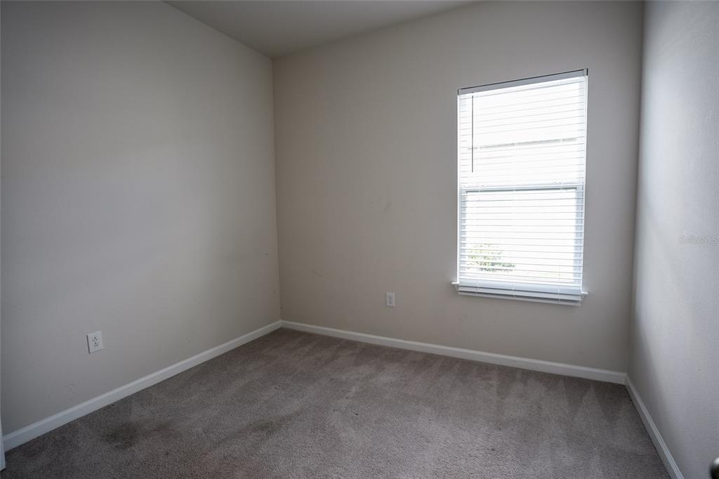 8606 Bonfire Way Parrish, FL 34219 - Photo 6 of 9 an empty room with a window