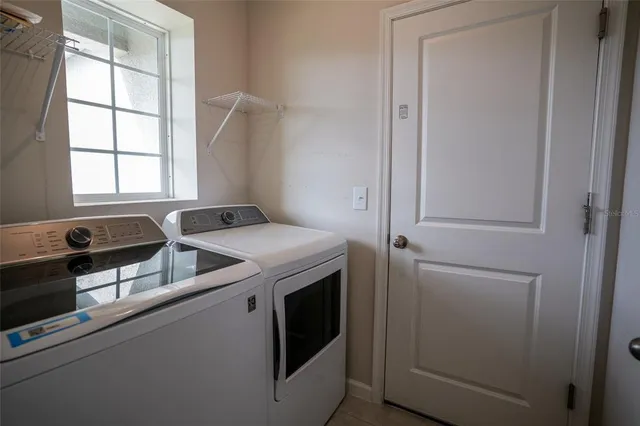 a utility room with dryer and washer