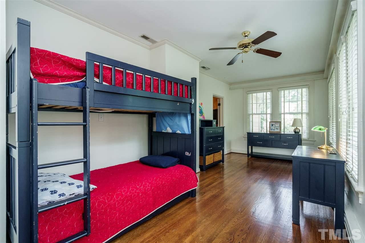 1631 St Marys Street Raleigh, NC 27608 - Photo 22 of 30 Large Secondary Bedroom is surrounded by windows.