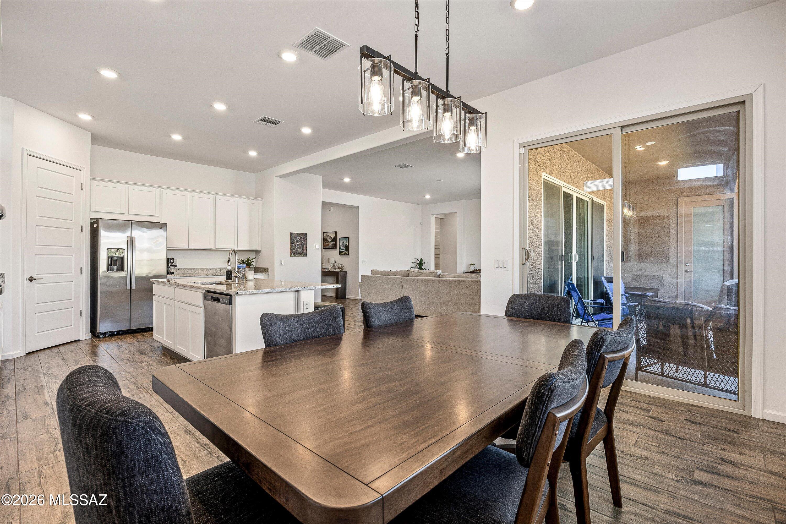 5196 West Ridgemont Court Tucson, AZ 85742 - Photo 15 of 46 Dining room featuring sliding glass door with access to the back patio