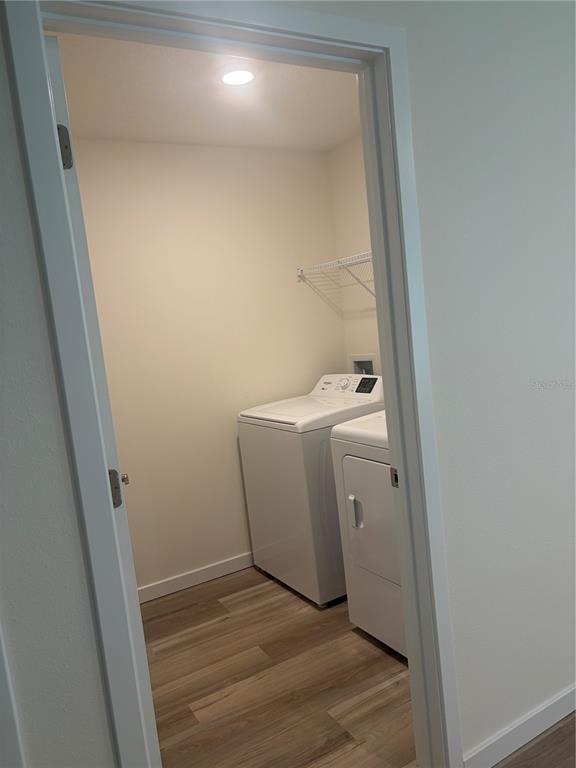 15886 Southeast 101st Ct Road Summerfield, FL 34491 - Photo 11 of 14 a view of a storage and utility room with a washer dryer