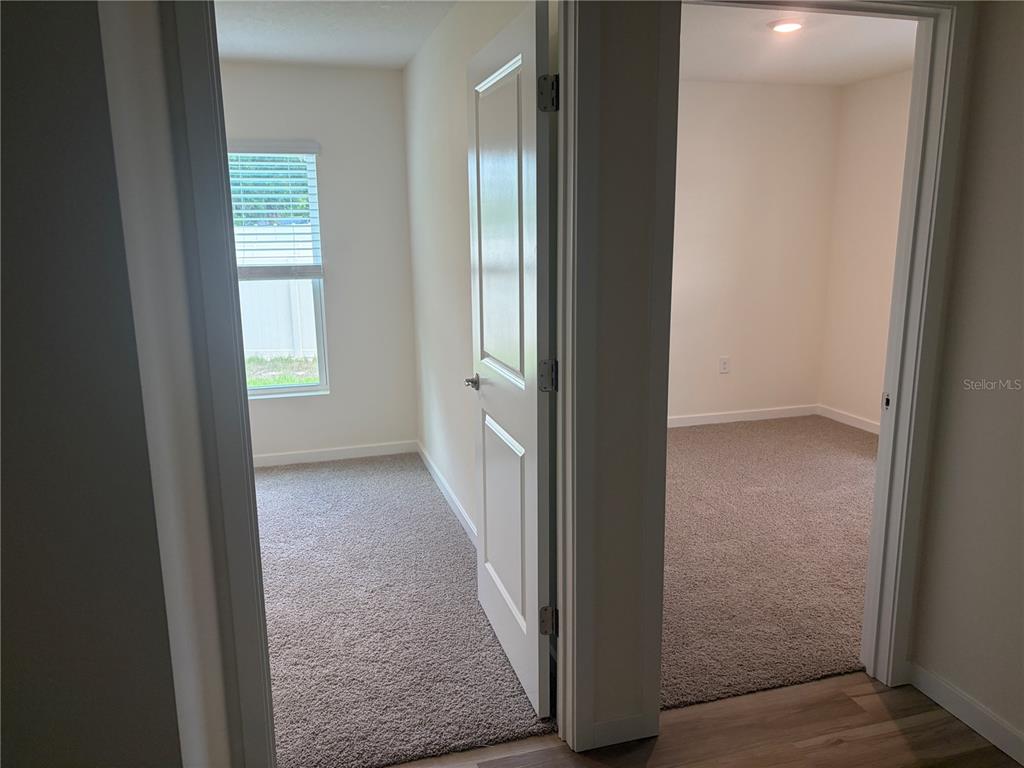 15886 Southeast 101st Ct Road Summerfield, FL 34491 - Photo 13 of 14 an entryway with a window in a kitchen