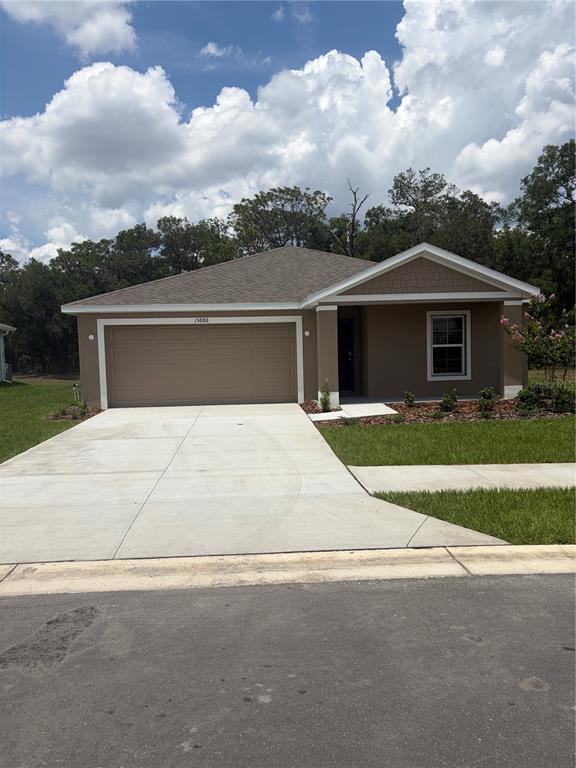 15886 Southeast 101st Ct Road Summerfield, FL 34491 - Photo 14 of 14 front view of house with a yard