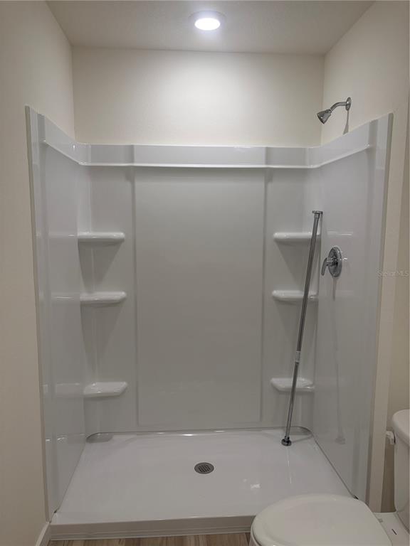 15886 Southeast 101st Ct Road Summerfield, FL 34491 - Photo 7 of 14 a bathroom with a shower