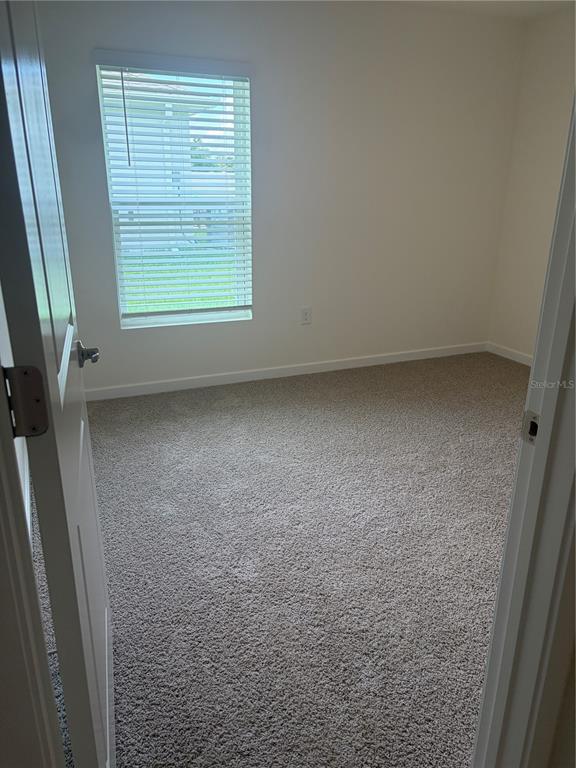 15886 Southeast 101st Ct Road Summerfield, FL 34491 - Photo 9 of 14 a view of a room that has a window in it