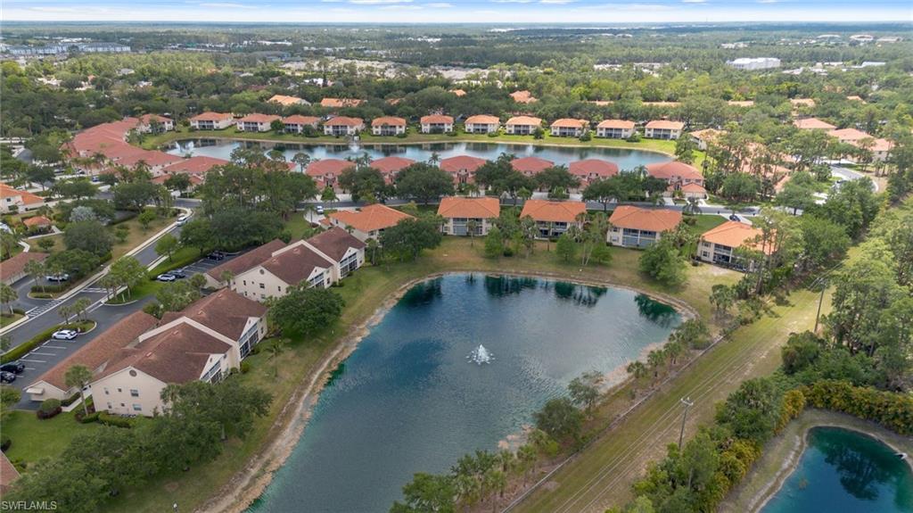 445 Robin Hood Circle, Unit 202 Naples, FL 34104 - Photo 18 of 23 an aerial view of residential houses with outdoor space