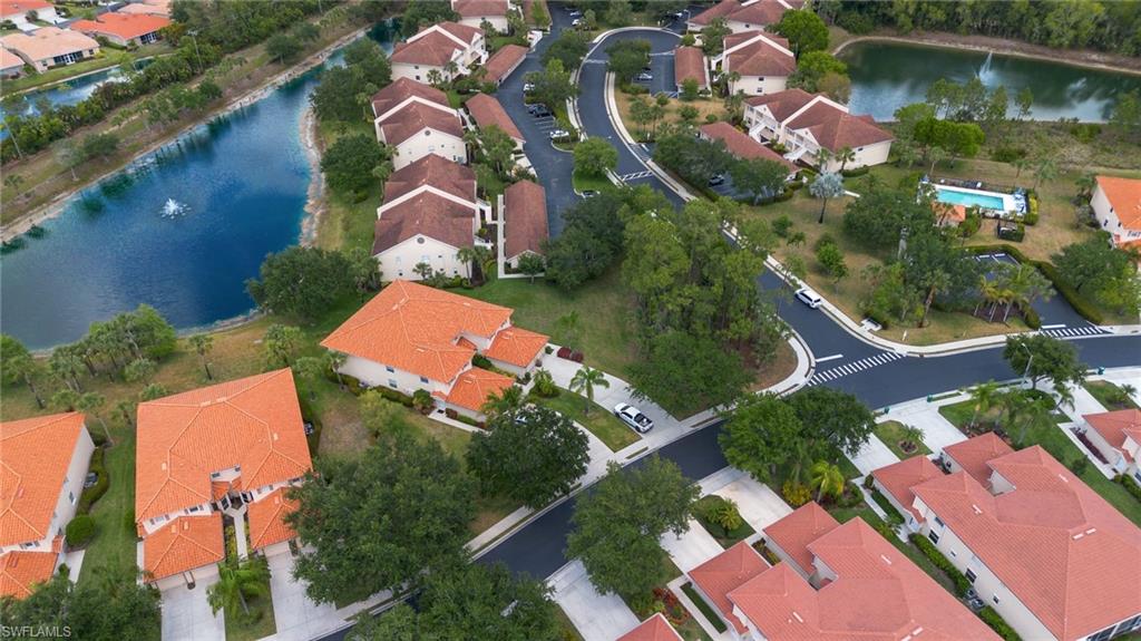 445 Robin Hood Circle, Unit 202 Naples, FL 34104 - Photo 19 of 23 an aerial view of residential house with outdoor space and swimming pool