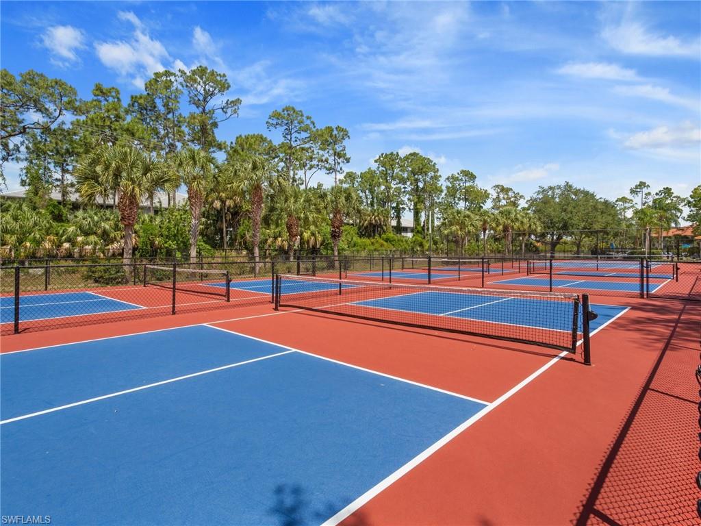 445 Robin Hood Circle, Unit 202 Naples, FL 34104 - Photo 20 of 23 a view of a tennis court