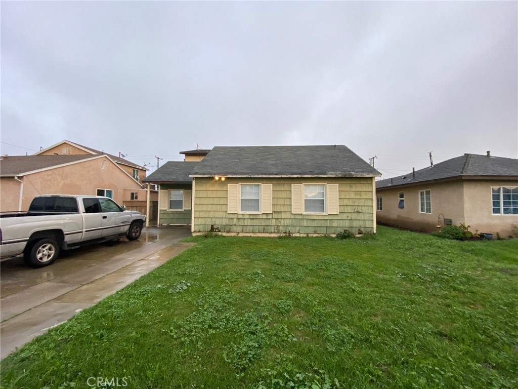 1190 South K Street Oxnard, CA 93033 - Photo 3 of 43 a view of a house with a back yard