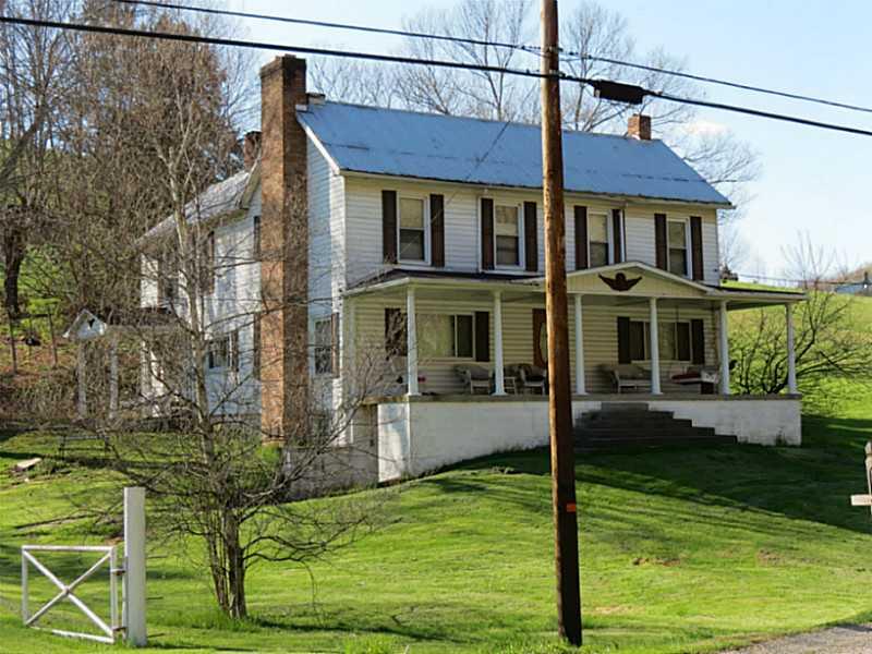 195 Smith Creek Road Spraggs, PA 15362 - Photo 2 of 25 Exterior Front. 4 Bedroom, Sweeping Front Porch....